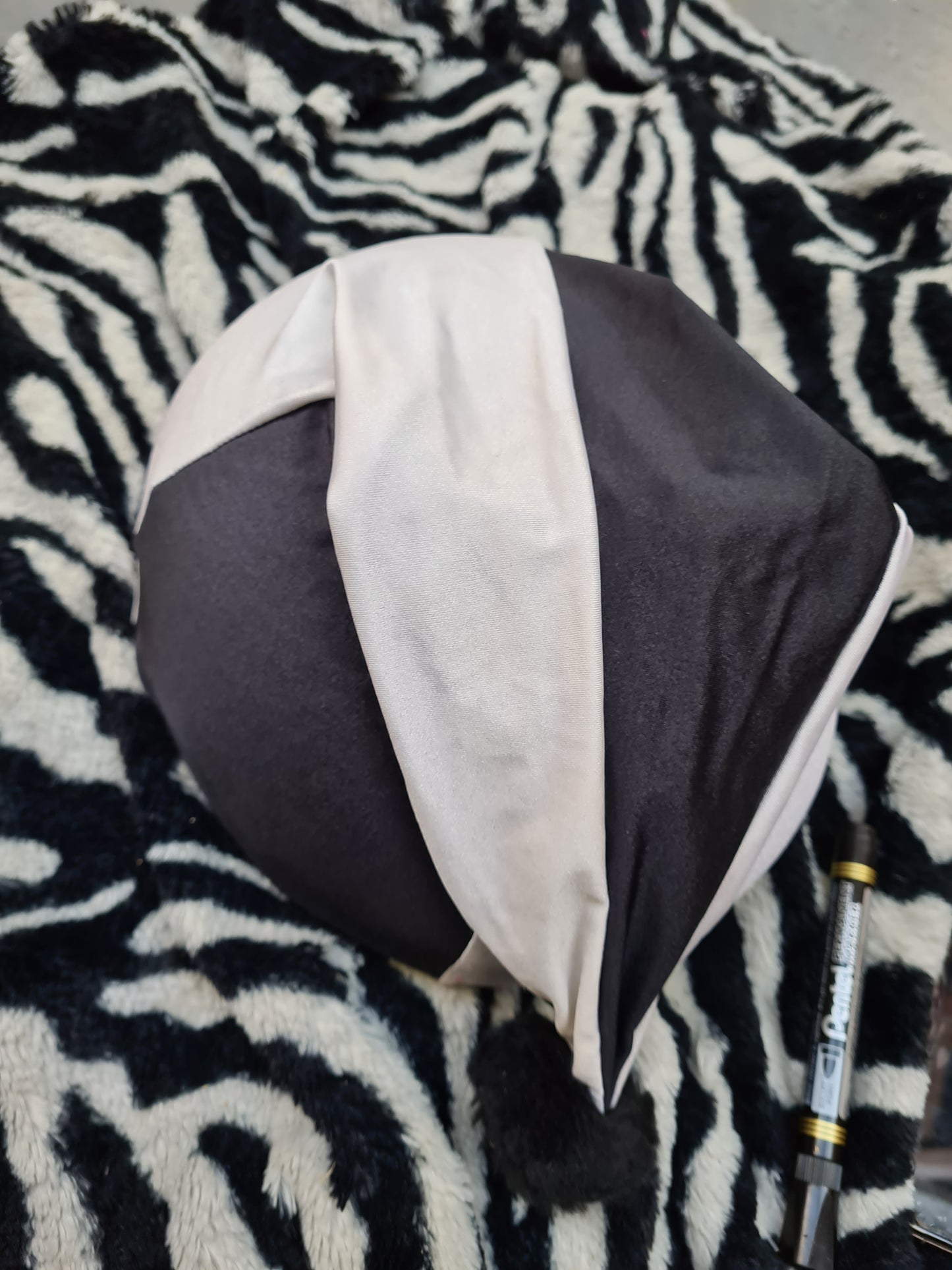 Used black and white silk hat cover