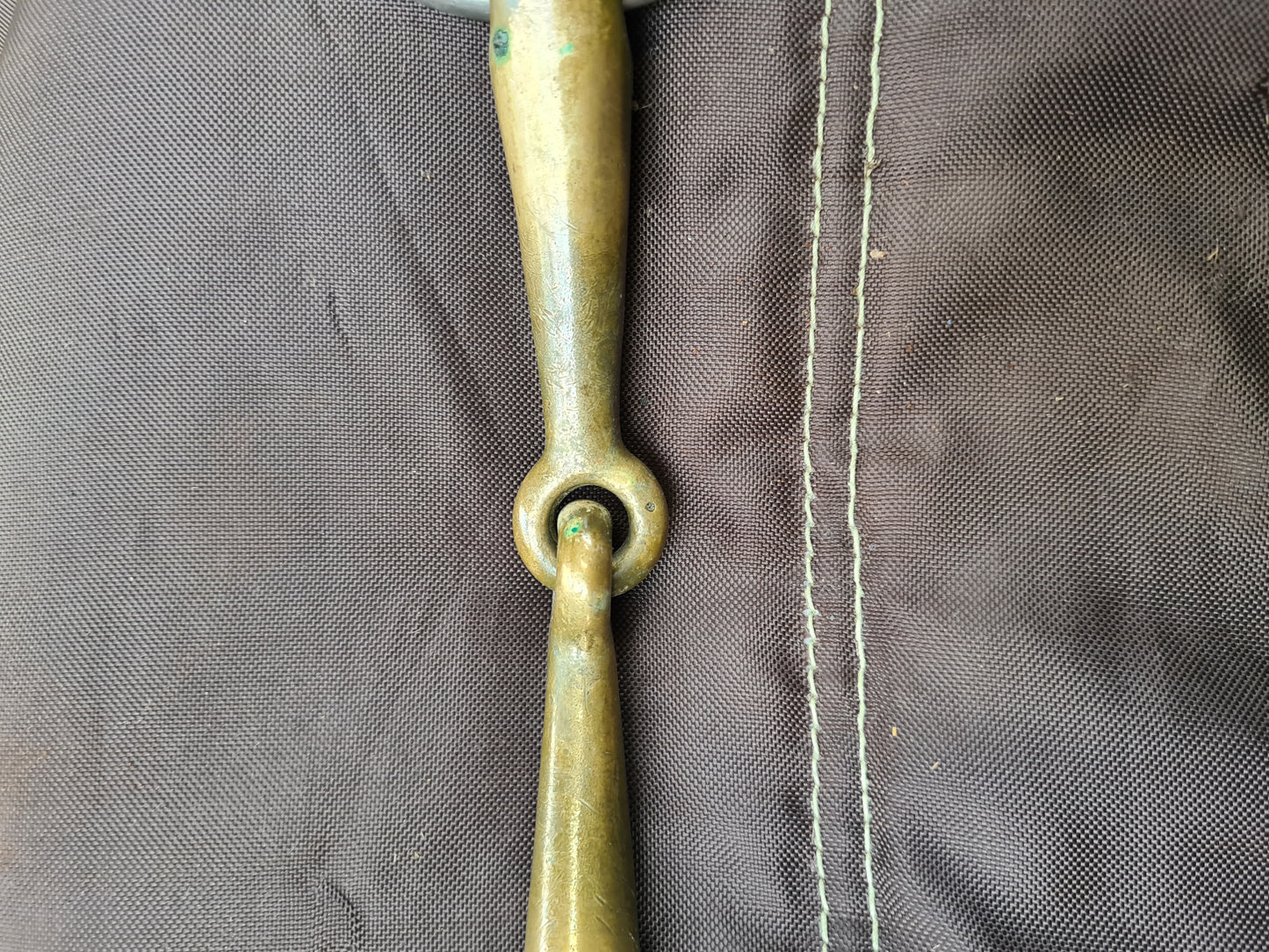 Used 5-1/2" brass loose ring snaffle bit