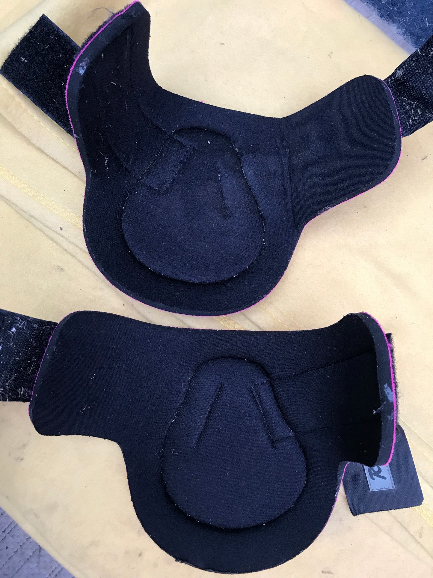 Requisite pink and black fetlock boots size large
