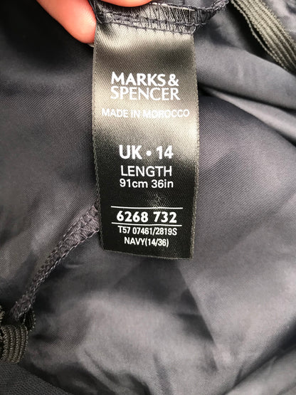 Marks and Spencer’s Navy in hand showing skirt  size 14 FREE POSTAGE🟢