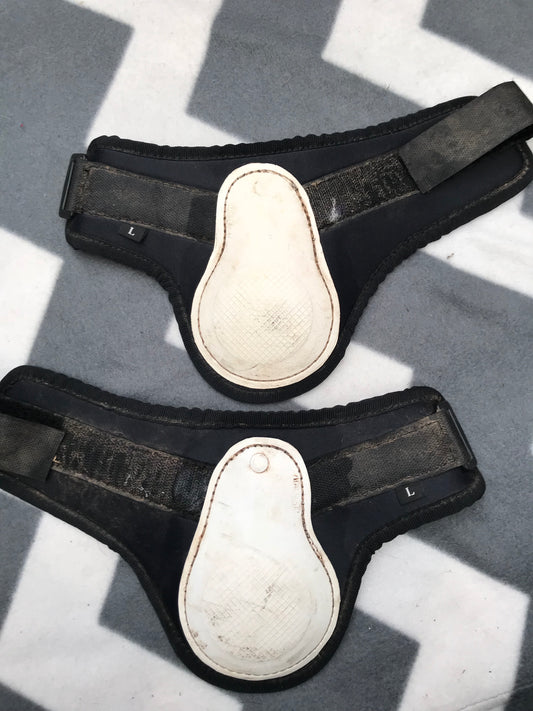 White and black fetlock boots size large