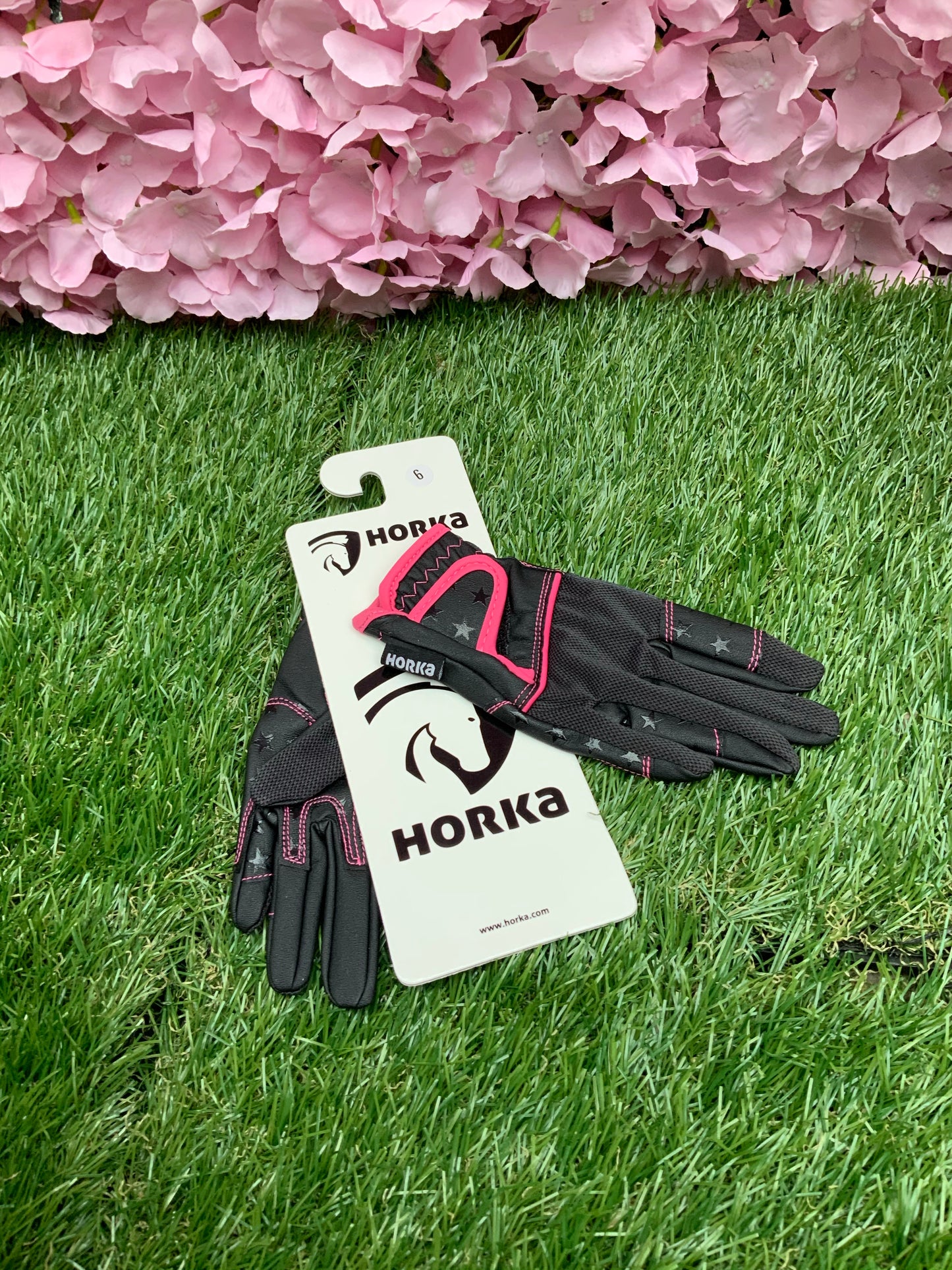 New children’s Horka black and pink riding gloves in size 6